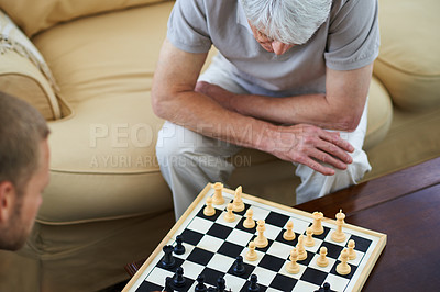 Buy stock photo Senior dad, man or playing chess in home for games or competition with strategy and problem solving. Elderly parent, above and board for challenge or learning thinking skills for cognitive function