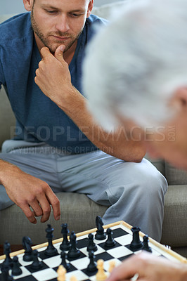 Buy stock photo Elderly dad, man or thinking of chess move in home for games or contest with strategy or problem solving. Senior parent, smart or board for challenge or learning mental skills for cognitive function