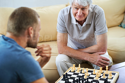 Buy stock photo Senior dad, man or chess checkmate in home for games or challenge with strategy or problem solving. Happy mature parent, smile or board for playing or learning thinking skills for cognitive function