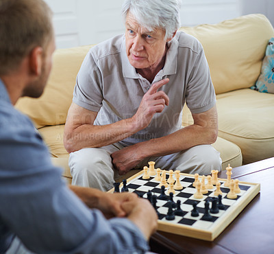 Buy stock photo Senior dad, man or teaching chess in home for games or competition with strategy and problem solving. Elderly parent, lesson and board for challenge or learning thinking skills for cognitive function