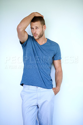 Buy stock photo Man, thinking and fashion in studio for style, confidence and aesthetic with trendy casual wear. Male person, cool and vision on white background for model pride, idea and clothes with relaxed outfit