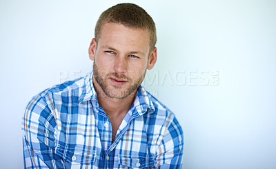 Buy stock photo Man, thinking and blue shirt with fashion for style or well groomed in studio on a wall background. Young, model or handsome male person in wonder, deep thought or contemplating in casual clothing