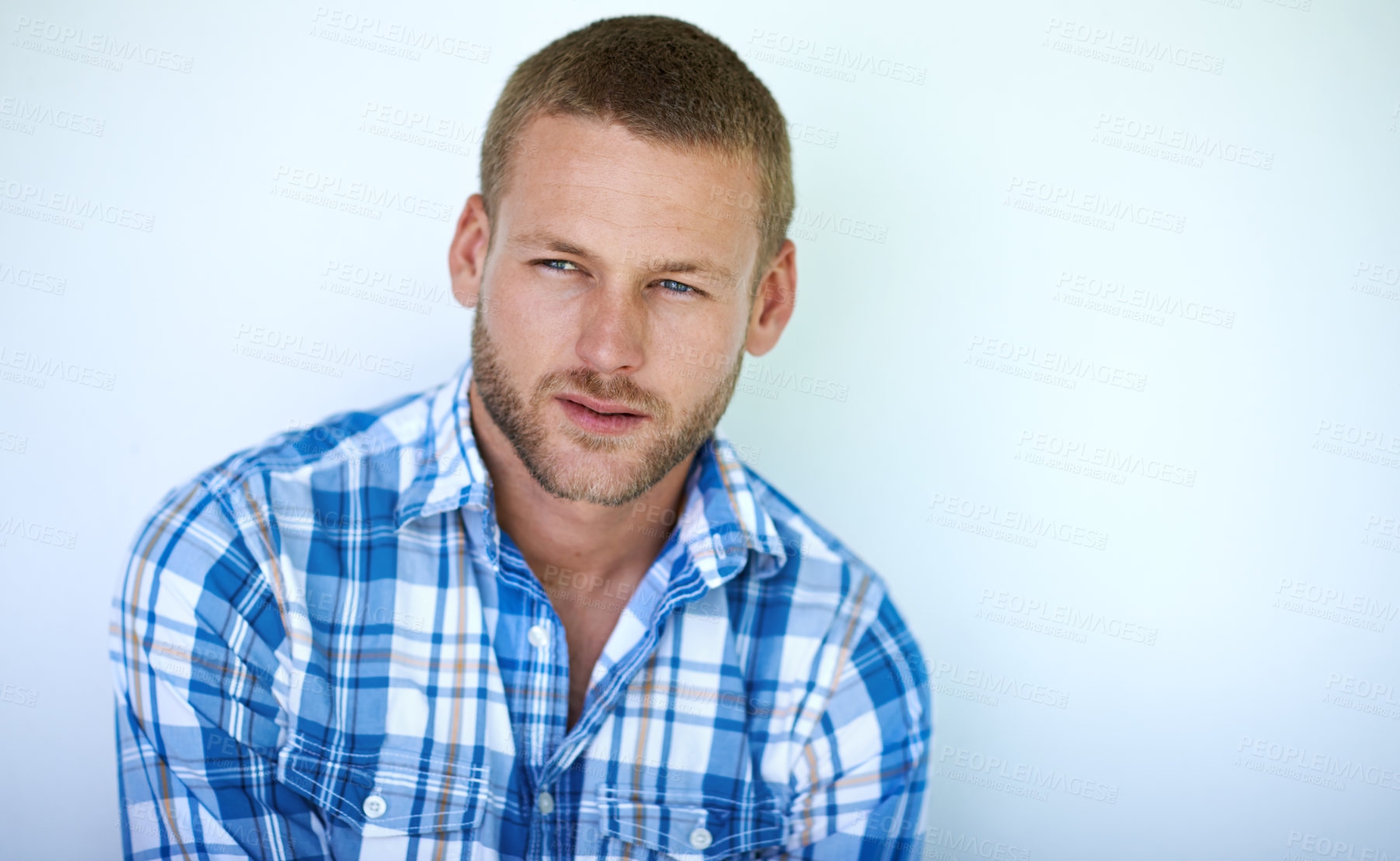 Buy stock photo Man, thinking and blue shirt with fashion for style or well groomed in studio on a wall background. Young, model or handsome male person in wonder, deep thought or contemplating in casual clothing