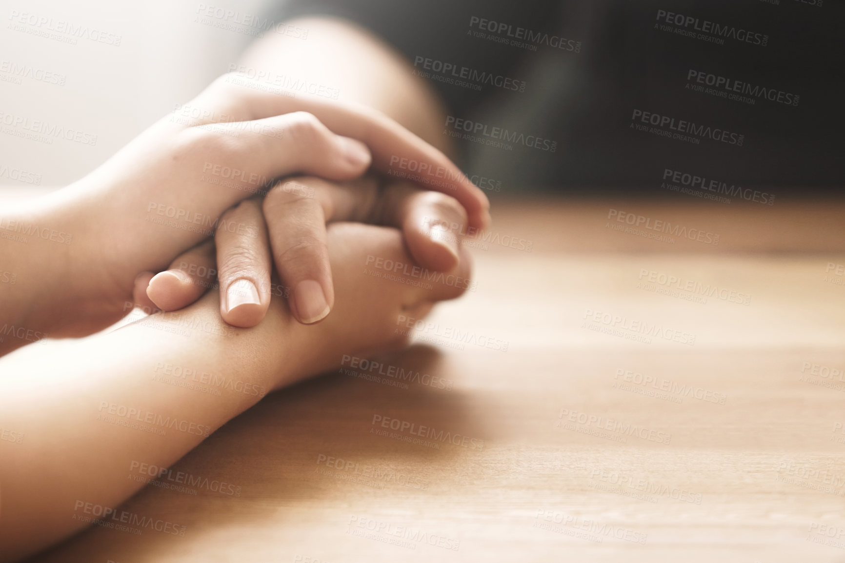 Buy stock photo Cropped shot of two people holding hands in comfort