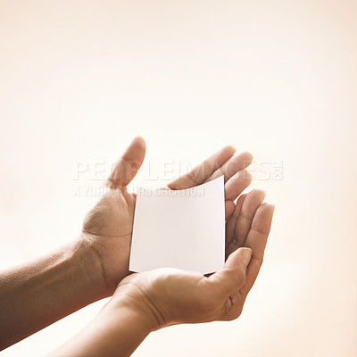 Buy stock photo Hands with blank paper, studio mockup and kindness on notification for support, trust and advice. Care, empathy and help on note with empty space for offer, promo or news on white background.