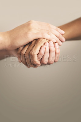 Buy stock photo Cropped shot of two people holding hands in comfort