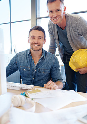 Buy stock photo Portrait of two handsome architects working together in their office