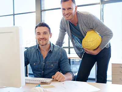 Buy stock photo Portrait of two handsome architects working together in their office