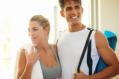 Buy stock photo Shot of a beautiful young woman and her boyfriend going to yoga class