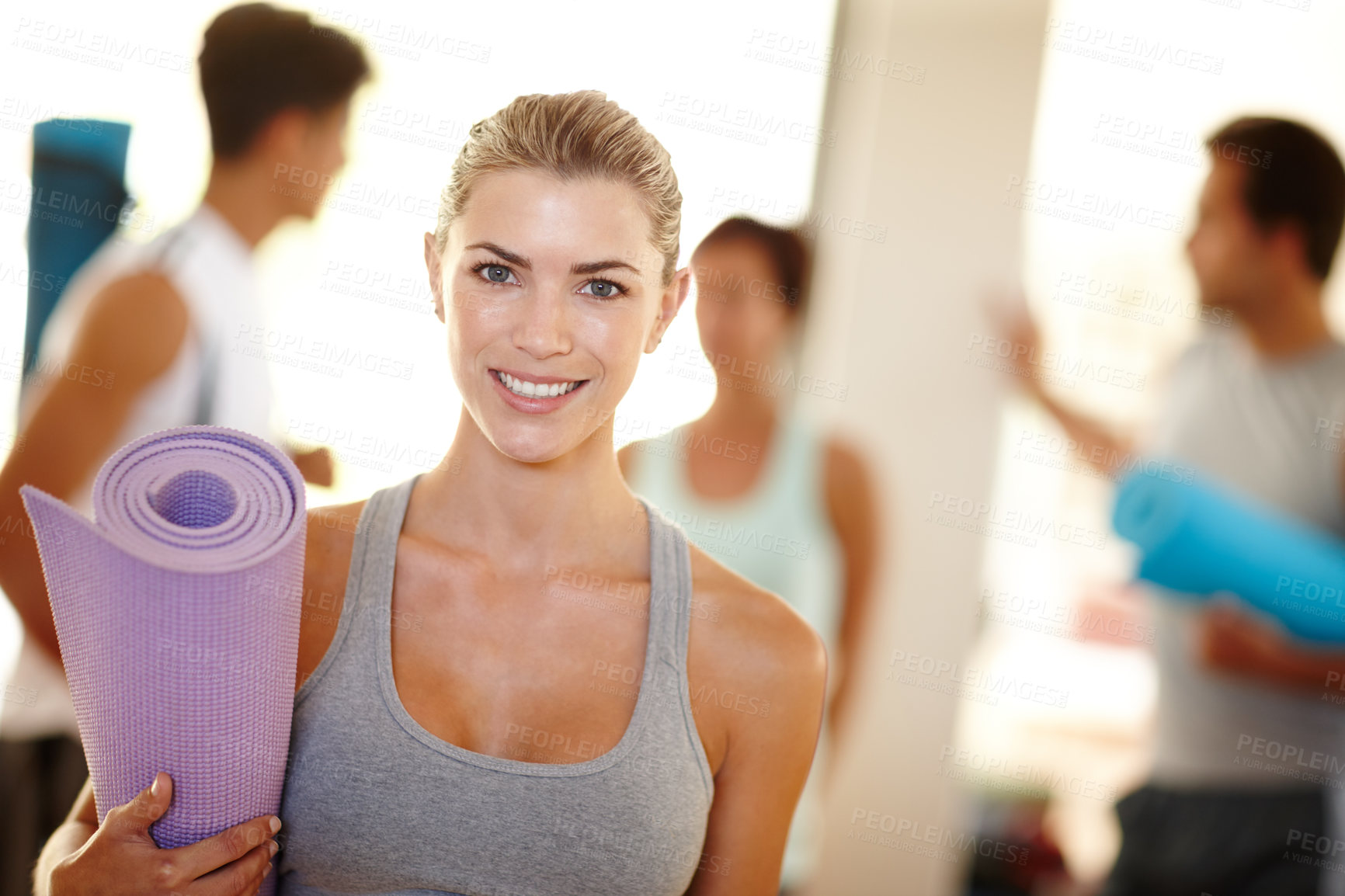 Buy stock photo Portrait of a beautiful woman with her yoga mat and people in the background