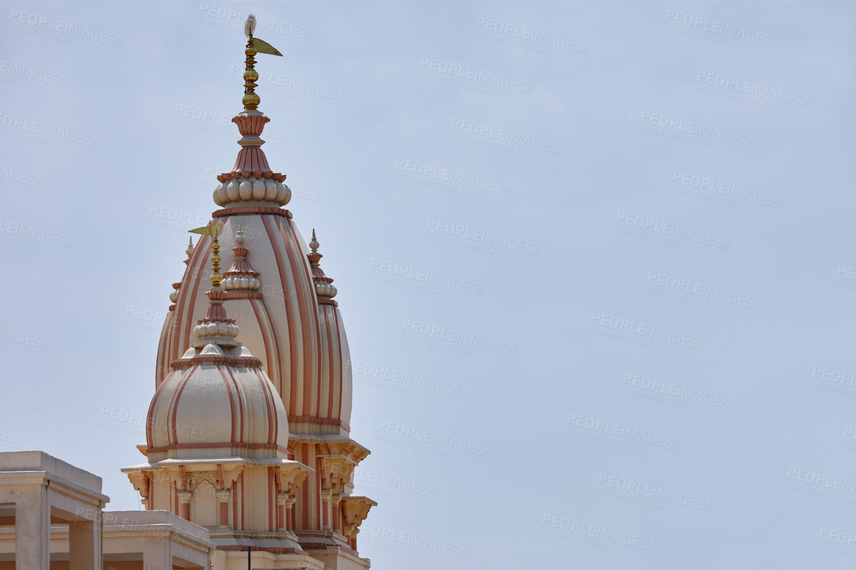 Buy stock photo Temple, spire and space in sky for religion, worship and travel wallpaper in India. Naba Brindaban, culture and architecture in city for Hinduism, spiritual atmosphere and Holy building for praise