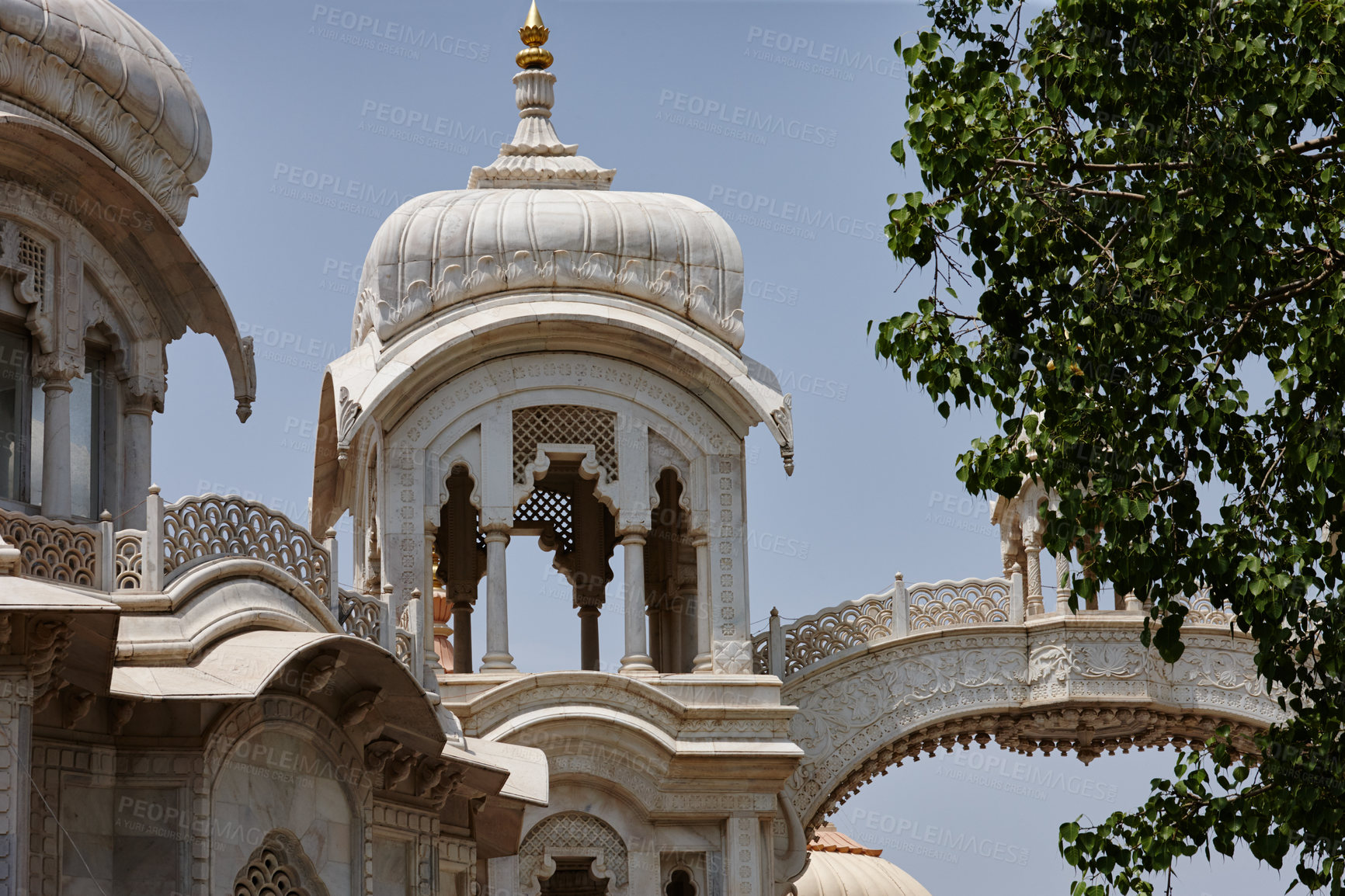 Buy stock photo Travel, temple and architecture in city for heritage, stonework and trees at place of worship in India. History, Hinduism and religious building in town for spirituality, culture or national landmark