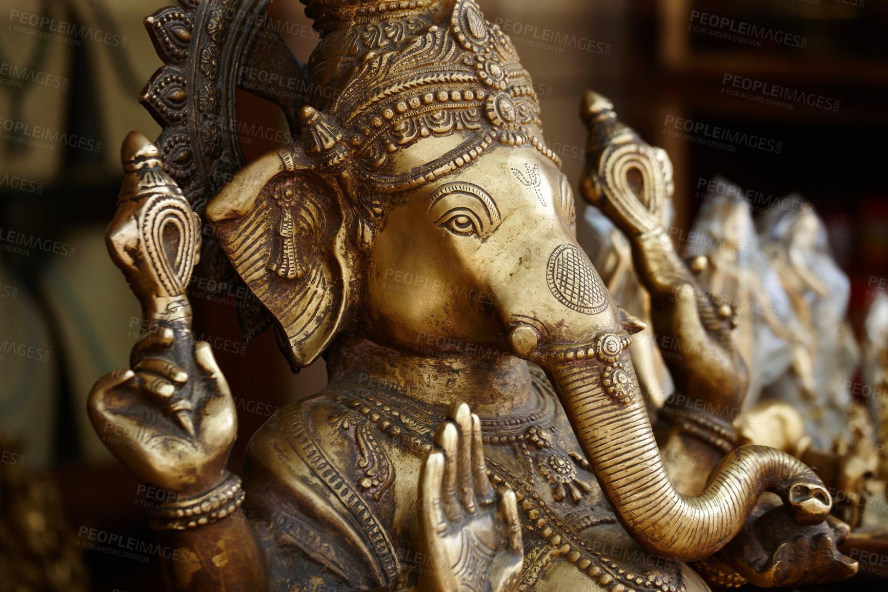 Buy stock photo Closeup of a bronze effigy of the god Ganesha in an Indian temple
