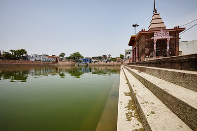 Buy stock photo Low angle view of Radha Kund, a sacred pool in India, which has mythological connotations to the god Krishna