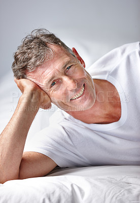 Buy stock photo Portrait of a mature man relaxing in bed