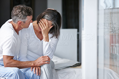 Buy stock photo Shot of a mature man consoling his wife who's feeling depressed
