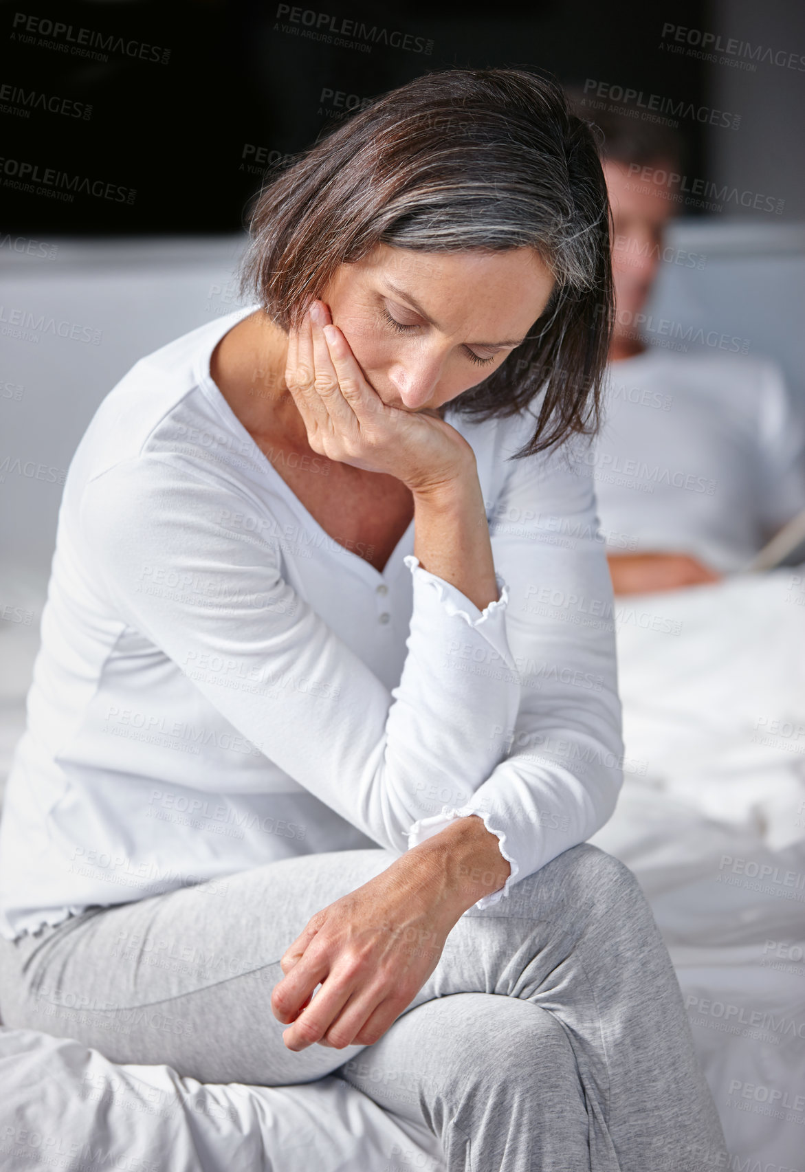 Buy stock photo Mature woman, depression and sadness in bedroom as couple for counselling, therapy and compassion. Female person, man and mental health in home for comfort, understanding and relationship for support