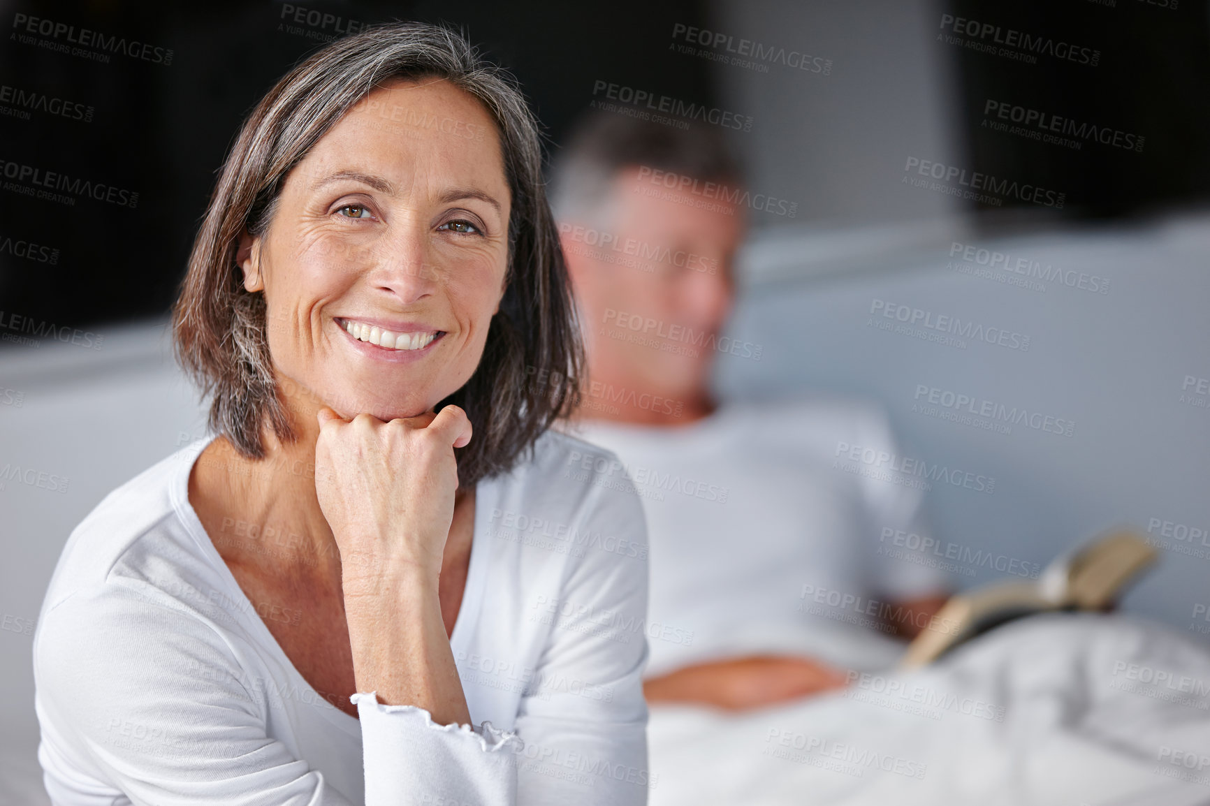 Buy stock photo Mature woman, happiness and portrait for marriage, together or bonding in bedroom or home. Female person, man and reading book as couple for comfort, stress relief and relationship as support or care