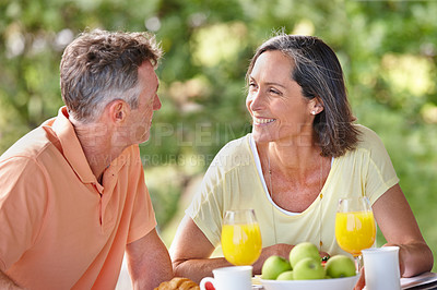 Buy stock photo Outdoor, breakfast and senior couple with love, smile and bonding together with conversation. Happiness, mature man and woman with care, nutrition and healthy meal with protein, diet and vitamins