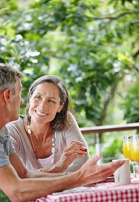 Buy stock photo Outdoor, breakfast and senior couple with meal, love and bonding together with conversation. Happiness, mature man and woman with care, nutrition and healthy food with protein, diet and orange juice