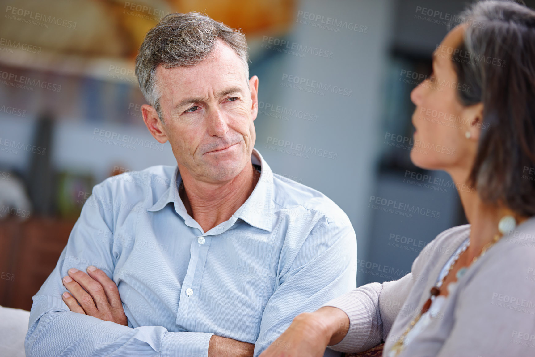 Buy stock photo Shot of a mature married couple having an argument at home