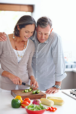 Buy stock photo House, cutting and senior couple with vegetables, nutrition and healthy meal with recipe. Apartment, old man and mature woman in kitchen, help and ingredients with food, wellness and relationship