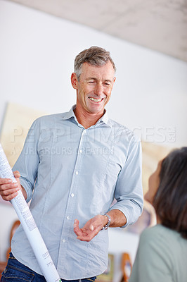Buy stock photo Shot of a mature man discussing building plans with his wife