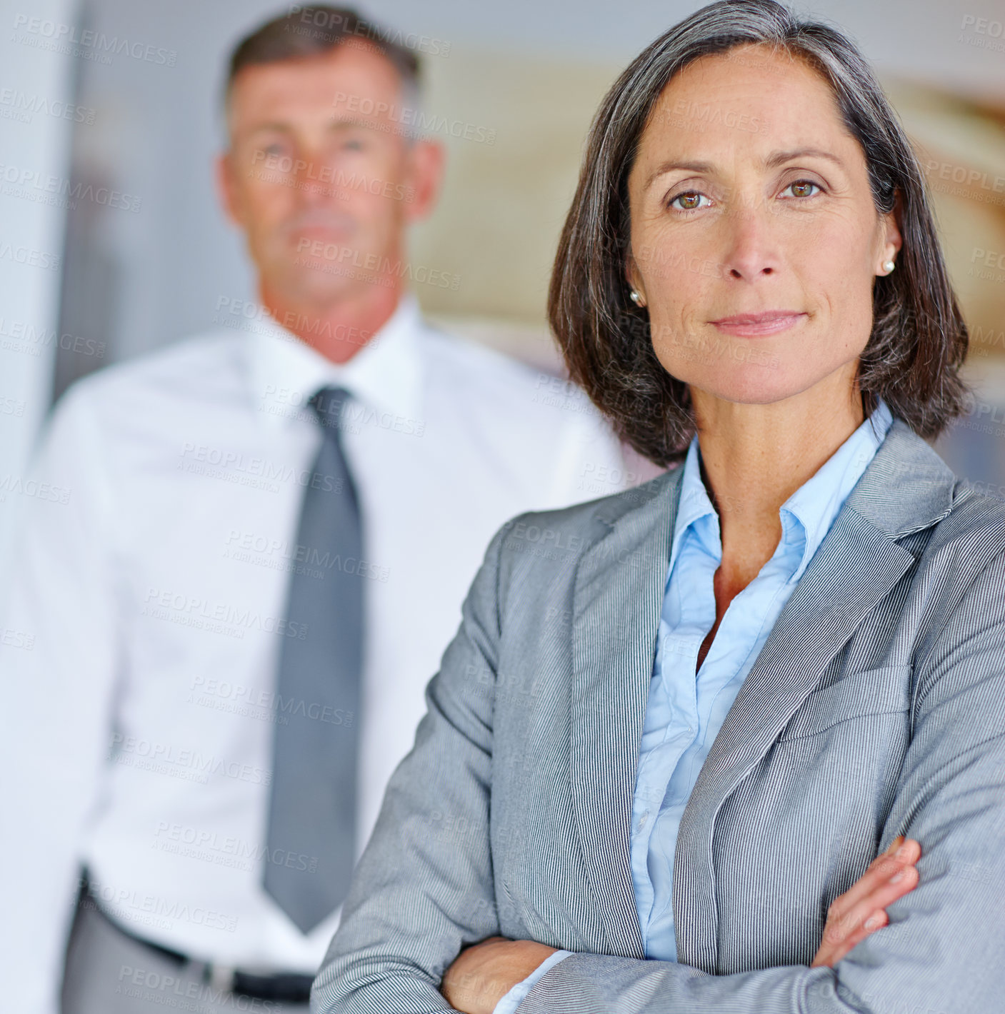 Buy stock photo Arms crossed, business and portrait of mature woman in office with colleague for company management. Corporate, leadership and suit with confident or proud  manager person in professional workplace