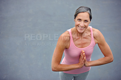 Buy stock photo High angle portrait of an attractive mature woman doing yoga outdoors