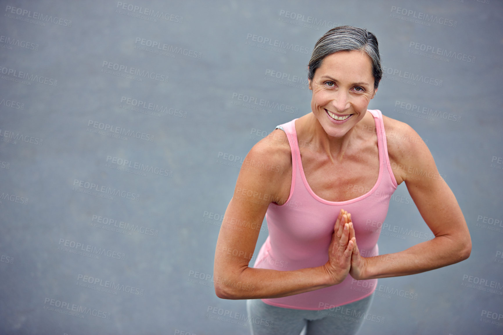 Buy stock photo High angle portrait of an attractive mature woman doing yoga outdoors