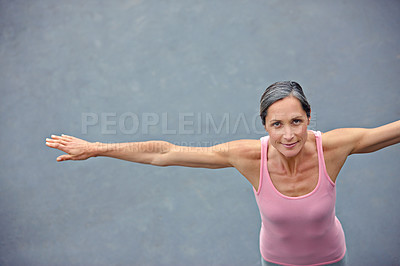 Buy stock photo High angle portrait of an attractive mature woman doing yoga outdoors