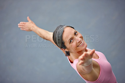 Buy stock photo High angle portrait of an attractive mature woman doing yoga outdoors