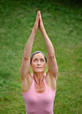 Buy stock photo Outdoor, grass and woman stretching with yoga for health, wellness and self care in Germany. Mature person, above and satisfied with upward pose for zen, workout and exercise for peace or relax