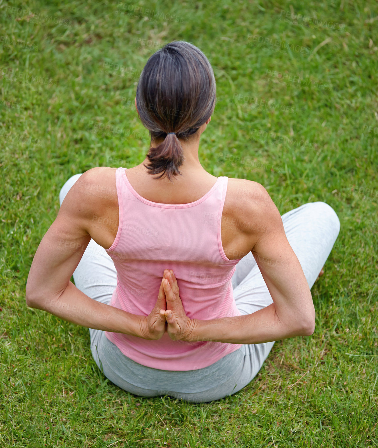 Buy stock photo Shot of an attractive mature woman doing yoga outdoors