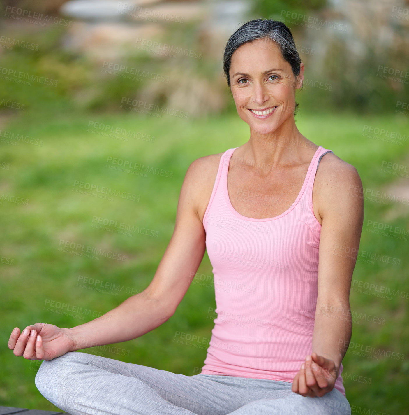 Buy stock photo Shot of an attractive mature woman practicing yoga in the lotus position