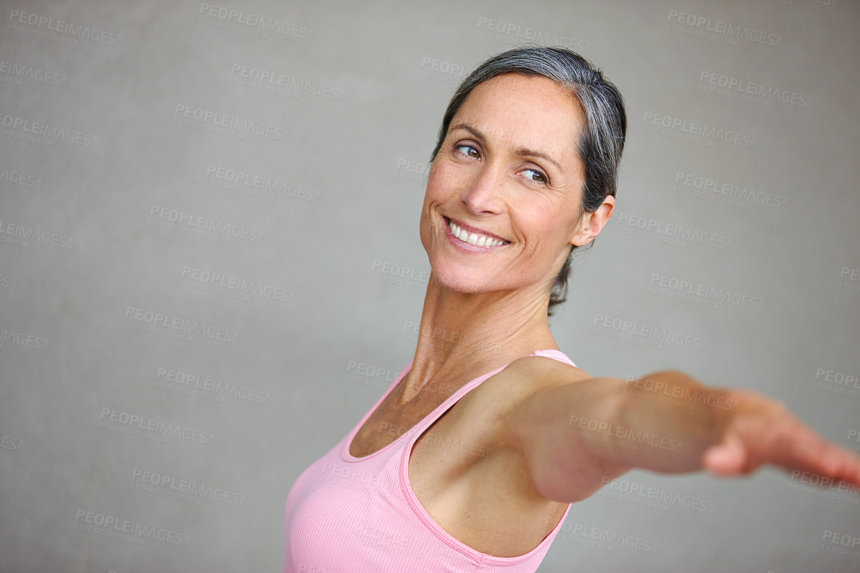 Buy stock photo Senior woman, fitness and arm stretching for yoga in studio with mockup for health, balance and exercise on wall background. Stretch, meditation and mature lady smile with zen for workout or training