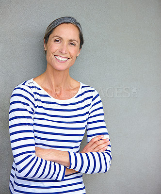 Buy stock photo Mature woman, arms crossed and portrait by wall at office with pride, confidence and career at media company. Person, writer and editor with mock up space, happy and job at creative agency in Germany