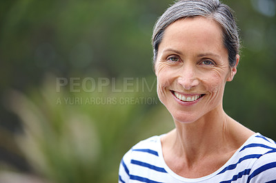 Buy stock photo Cropped portrait of an attractive mature woman in casualwear standing outdoors