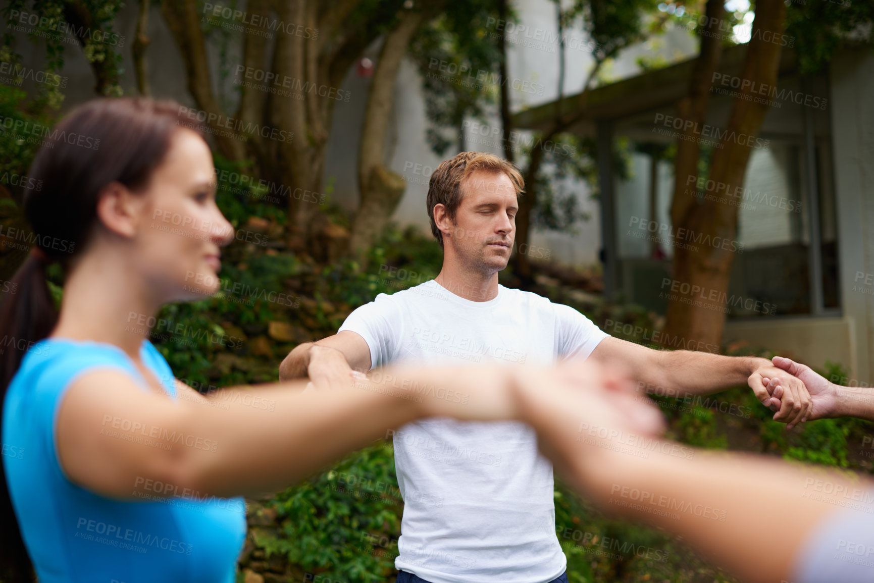 Buy stock photo Meditation, holding hands and peace with man in circle in yoga class for spiritual retreat, health and zen. Wellness, fitness and connection with group of people in nature for balance and pilates