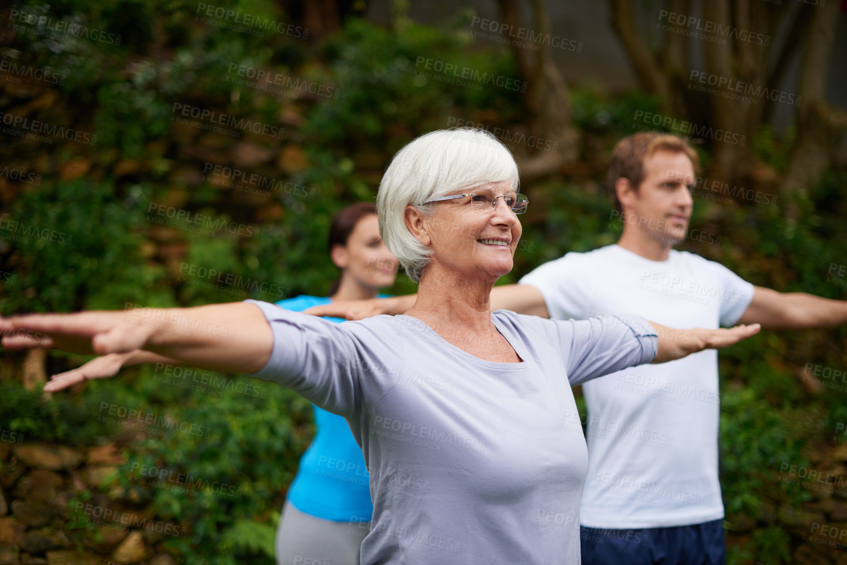 Buy stock photo Park, senior or woman in yoga class for stretching arms, balance or inner peace in nature. Group meditation, smile or happy elderly person with people for spiritual healing, energy or mindfulness