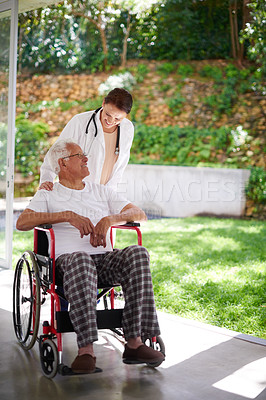 Buy stock photo Full length shot of a senior man in a wheelchair talking to his doctor