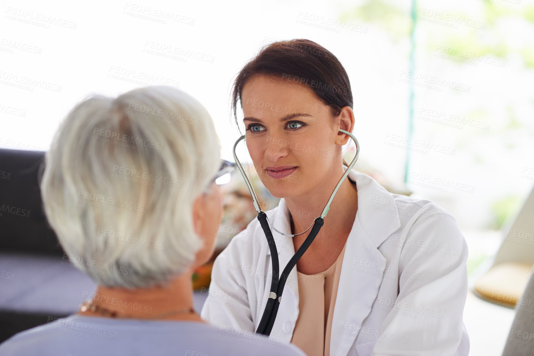 Buy stock photo Doctor, senior woman and listen with stethoscope for medical assessment, check and results. People, medic and elderly patient for help for breathing, lungs or cardiology in retirement at nursing home