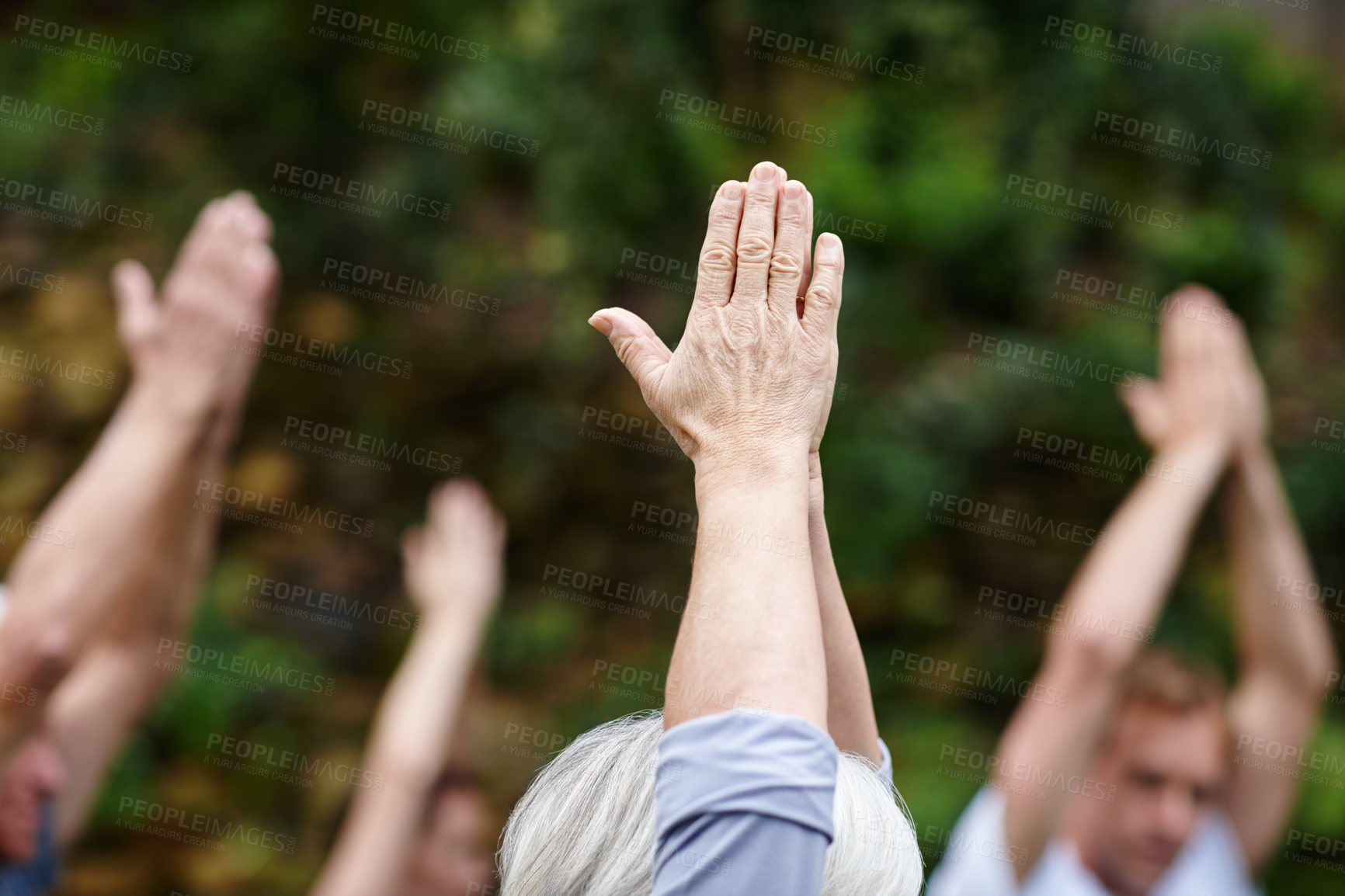 Buy stock photo Cropped shot of a senior person standing with their hands stretched upwards