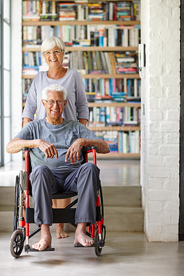 Buy stock photo Portrait of a senior woman standing behind her husband who's in a wheelchair