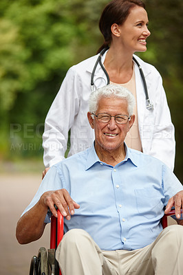 Buy stock photo Portrait of a senior man in a wheelchair being pushed by his female doctor