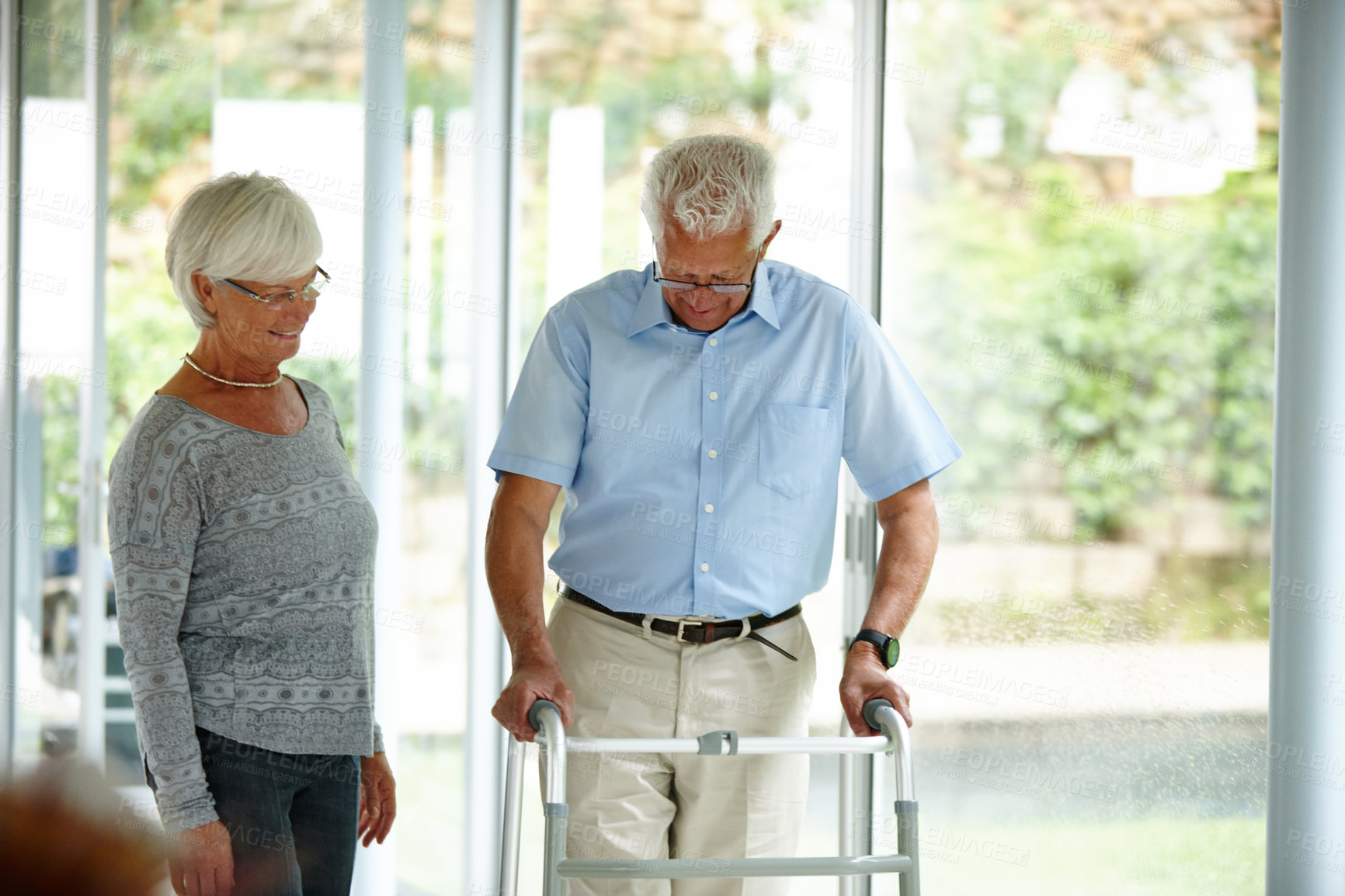 Buy stock photo Walking frame, help and senior couple in clinic with support, recovery and medical aid for balance. Retirement home, walker and mature woman and man with disability for mobility, movement or wellness