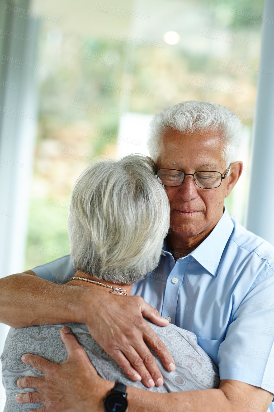 Buy stock photo Senior man, woman and hug for support in home with comfort, care and connection with love in retirement. Elderly people, couple and embrace for solidarity, empathy and loyalty with trust at apartment