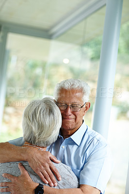 Buy stock photo Senior man, woman and hug for care in home with support, comfort and connection with love in retirement. Elderly people, couple and embrace for solidarity, empathy and loyalty with trust at apartment