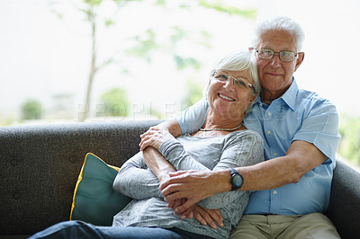 Buy stock photo Shot of a happy senior couple smiling at the camera