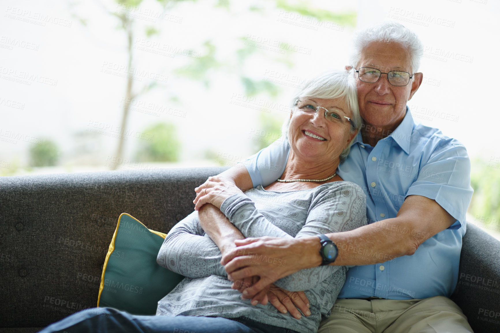 Buy stock photo Embrace, portrait and senior couple on sofa with love, care or happy marriage in retirement together. Hug, elderly man and old woman on couch with smile, support or comfort in morning bonding in home